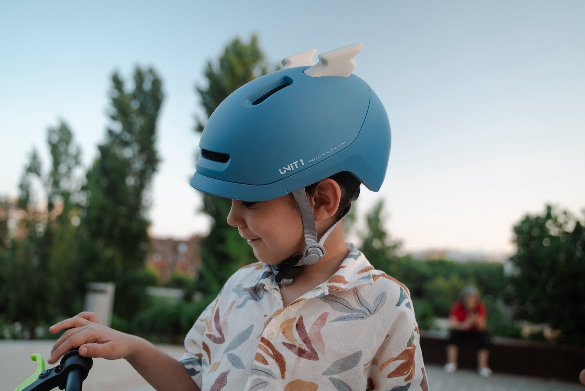 Child wearing a blue bike helmet, emphasizing kids bike helmet safety during outdoor play.
