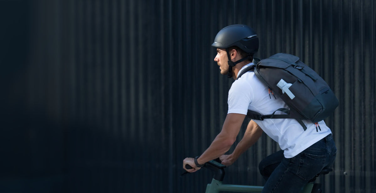 man on a bike with UNIT1 Helmet