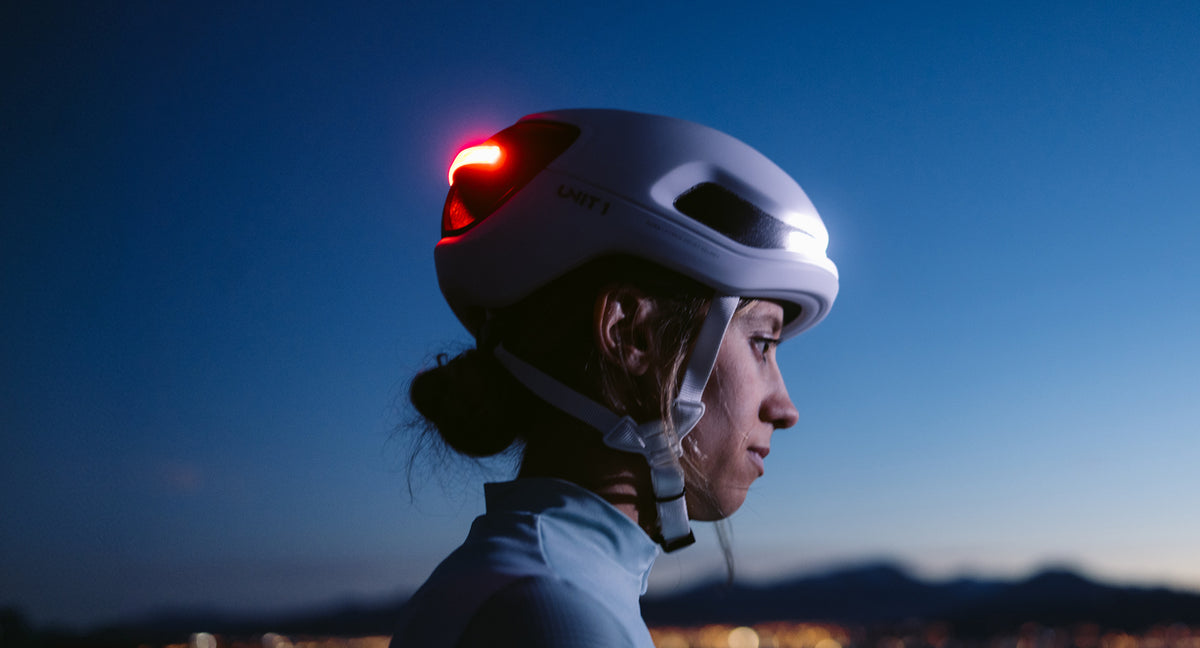 Rider wearing AURA MIPS with mountains at dusk