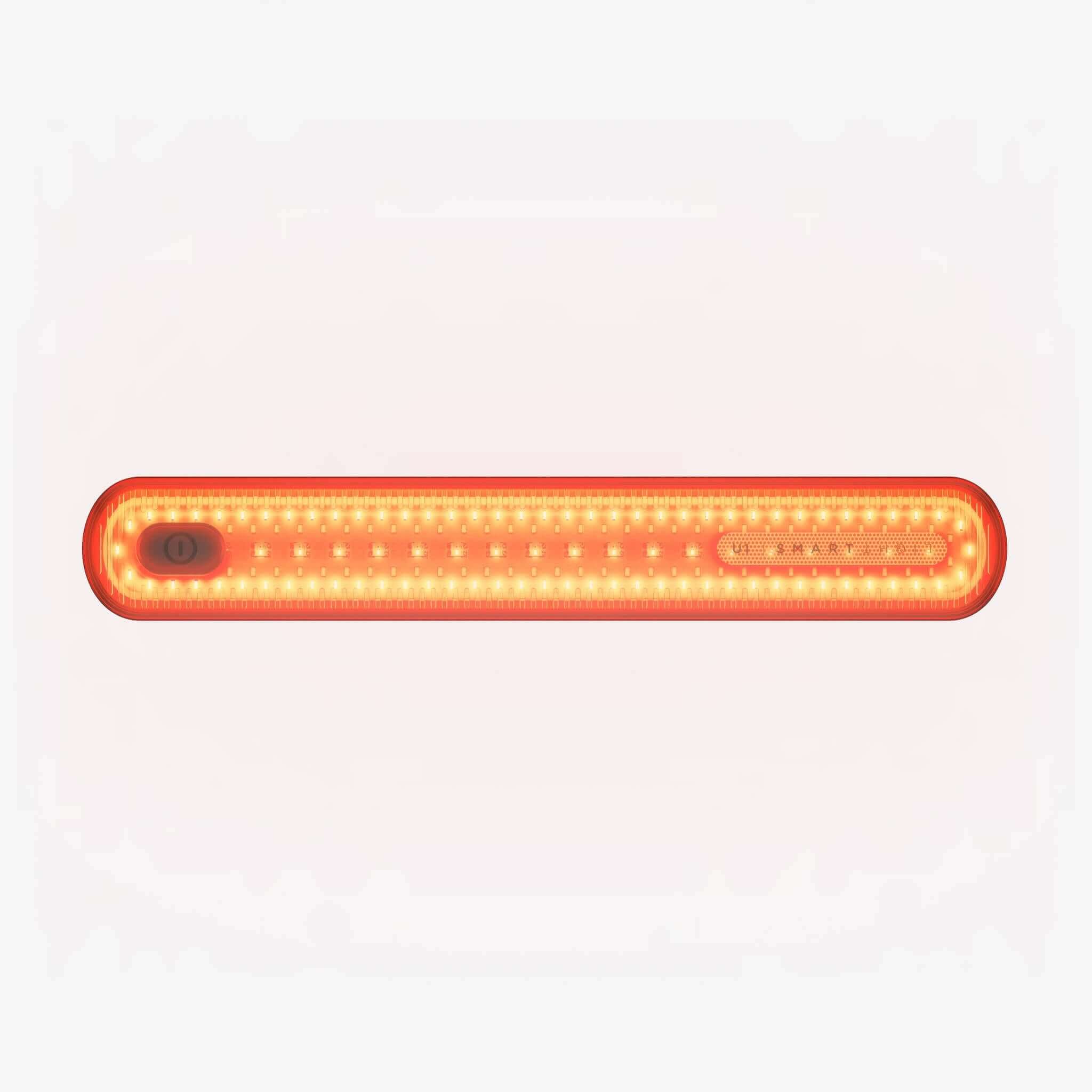 A two-button remote control with illuminated arrows pointing left and right.